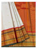 Pleated view of the saree showing blush pink body, ornate red pallu, and broad gold-toned border