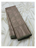 Folded sage green Kanchipuram silk saree with antique gold woven body and broad zari border