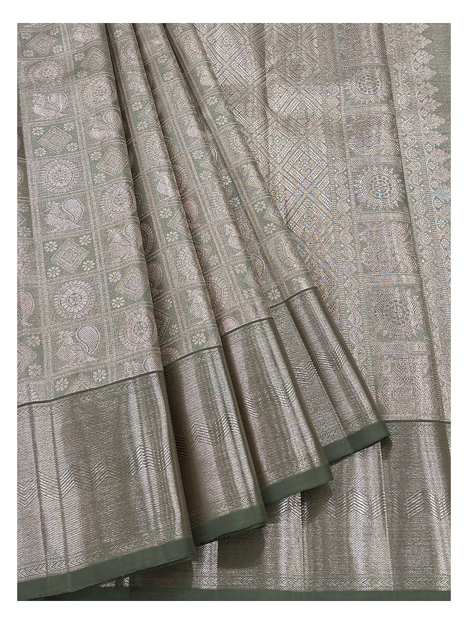 Detailed view of handwoven Kanchipuram silk saree showing motif panels and antique gold woven border