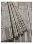 Detailed view of handwoven Kanchipuram silk saree showing motif panels and antique gold woven border