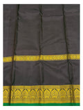 Close view of deep plum pallu with gold-toned woven border detail and green selvedge