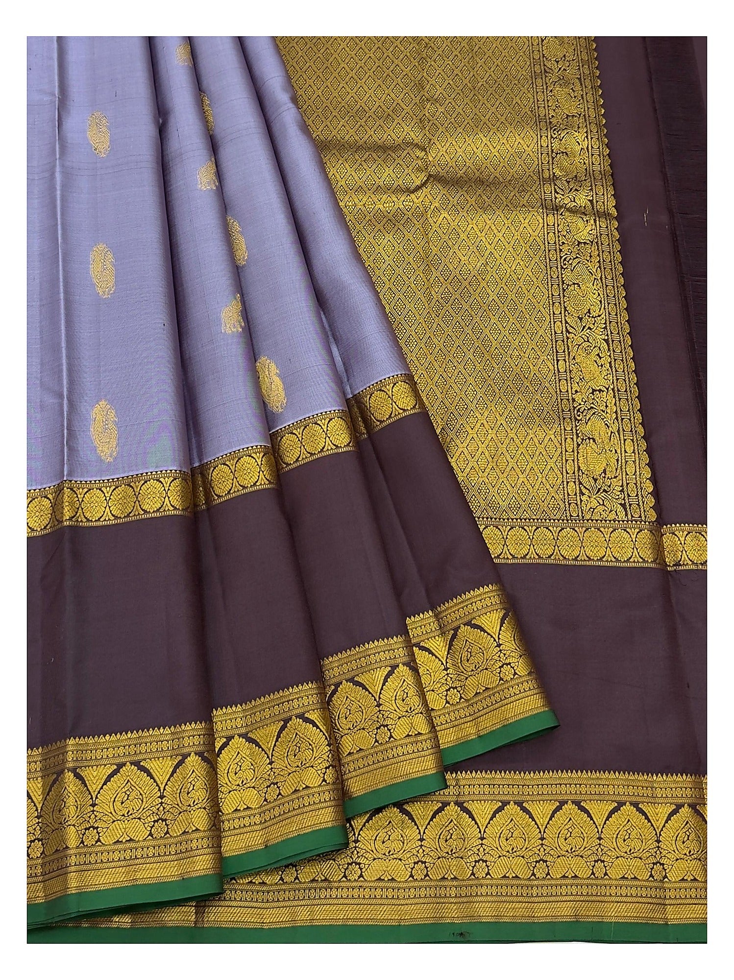 Draped view of lavender and deep plum Kanchipuram silk saree with patterned pallu and wide contrast border