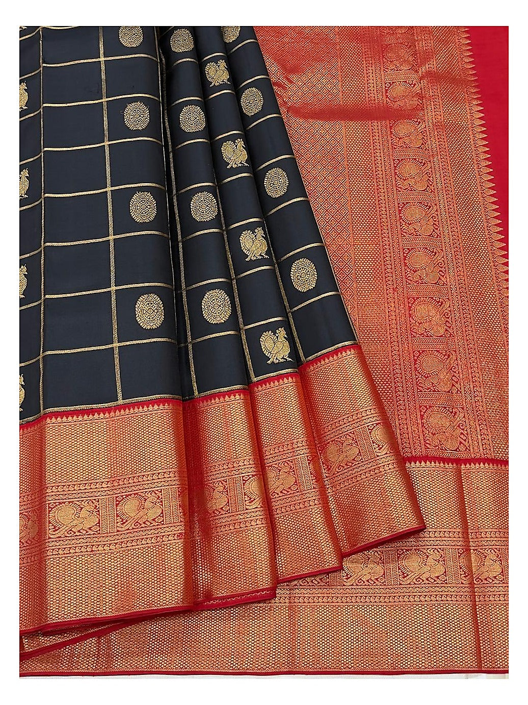 Close view of the navy blue saree with gold-toned checks, woven motifs, and broad red pallu