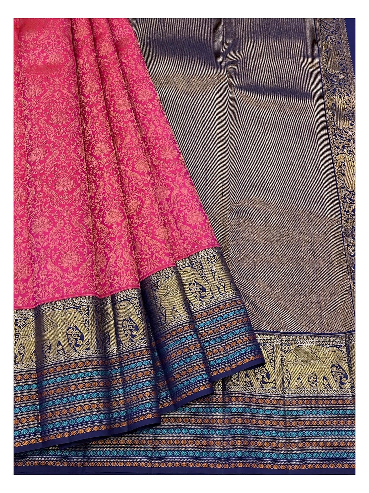Draped view of the pink saree showing zari motifs, navy border, and multicolour woven stripe accents