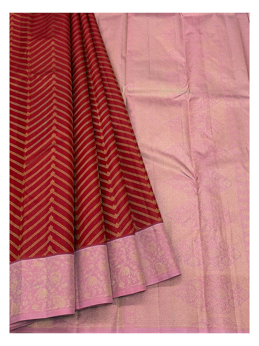Red pure silk saree with pink floral border and matching pink pallu spread open