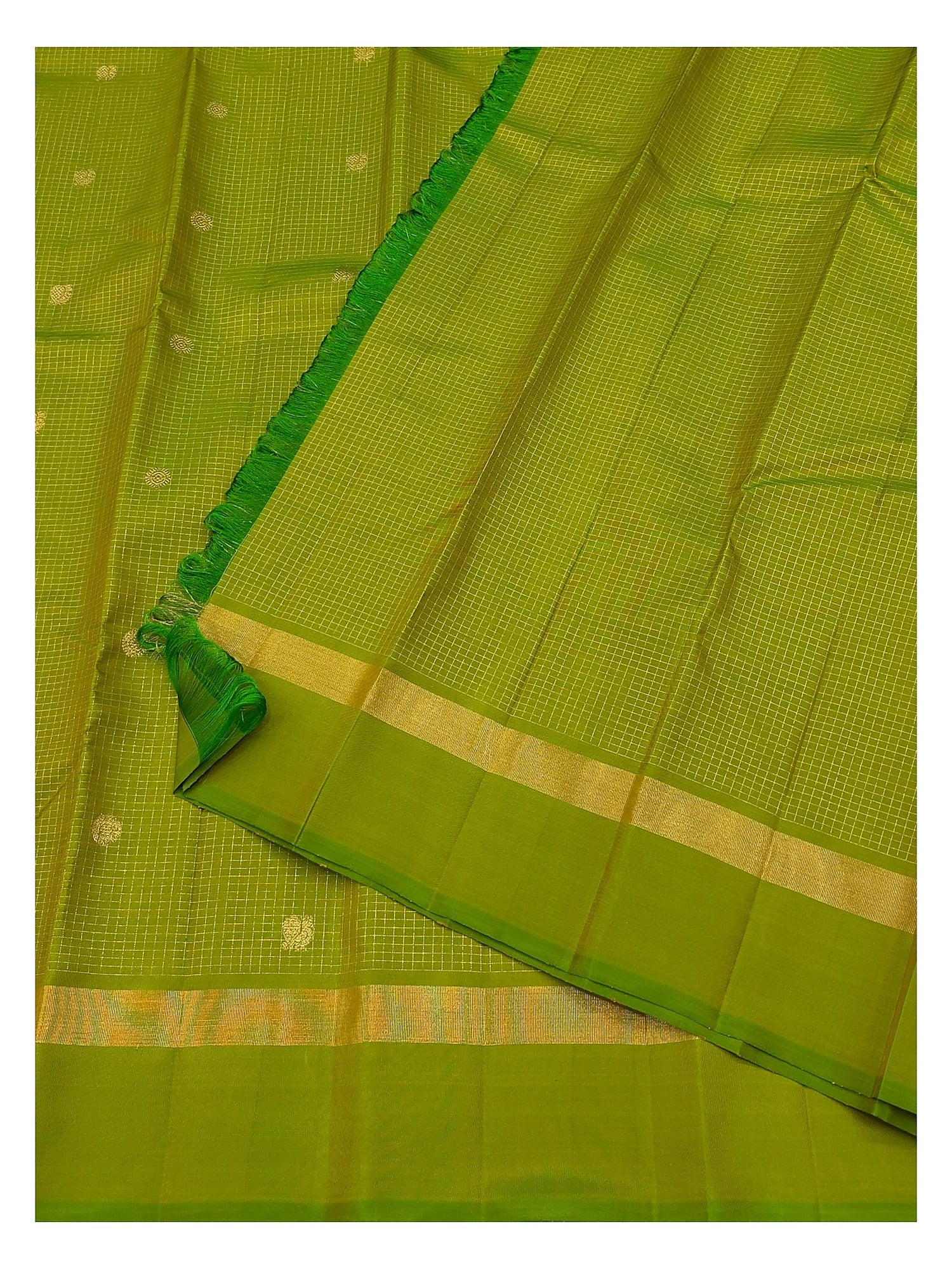 Green saree with fine gold checks, small butta motifs and folded woven border detail