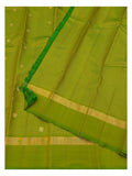 Green saree with fine gold checks, small butta motifs and folded woven border detail