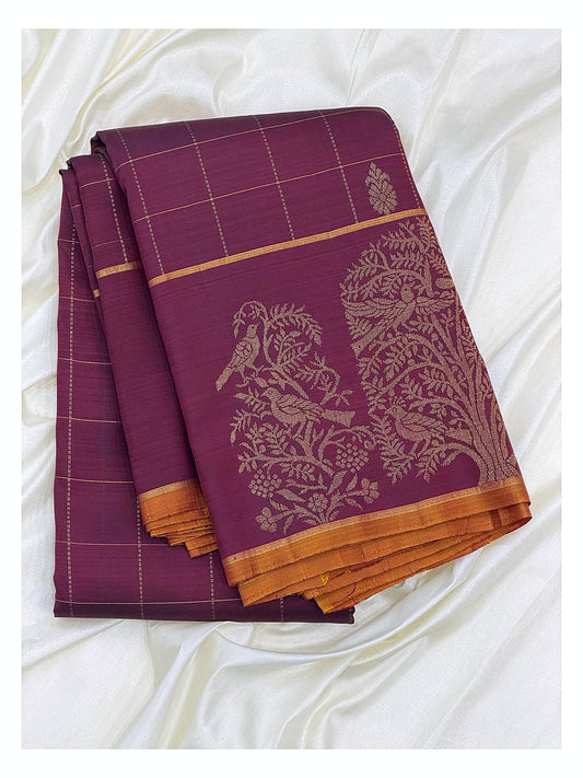 Folded magenta handwoven Kanchipuram silk saree with gold butta motifs and bird motif border