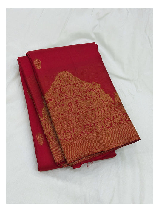 Deep pink handwoven Kanchipuram silk saree with broad gold zari border and woven motif pallu detail