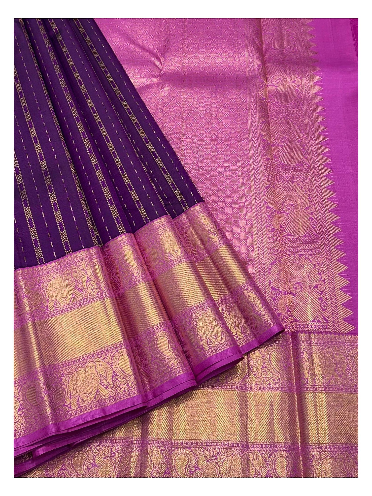 Deep purple handwoven Kanchipuram silk saree with magenta-gold pallu and broad elephant motif border