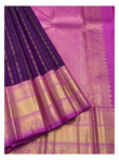 Deep purple handwoven Kanchipuram silk saree with magenta-gold pallu and broad elephant motif border