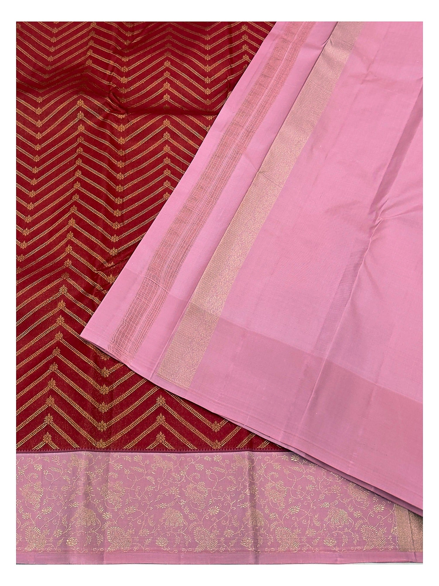 Close view of pink blouse piece and border on red pure silk saree