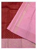 Close view of pink blouse piece and border on red pure silk saree