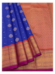 Royal blue saree with folded pleats and matching magenta blouse piece