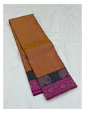 Folded mustard pure silk saree showing elephant motif contrast border and magenta border