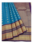 Pure Silk Saree - Draped view showing teal body and rich woven pallu