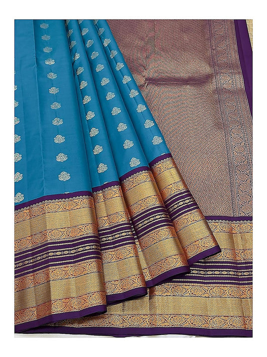 Pure Silk Saree - Draped view showing teal body and rich woven pallu