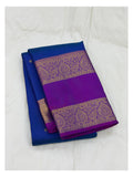 Folded royal blue handwoven Kanchipuram silk saree with magenta contrast pallu and gold-toned woven border