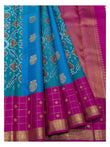 Draped detail of sky blue saree with teal pallu, magenta zari border and woven gold motifs