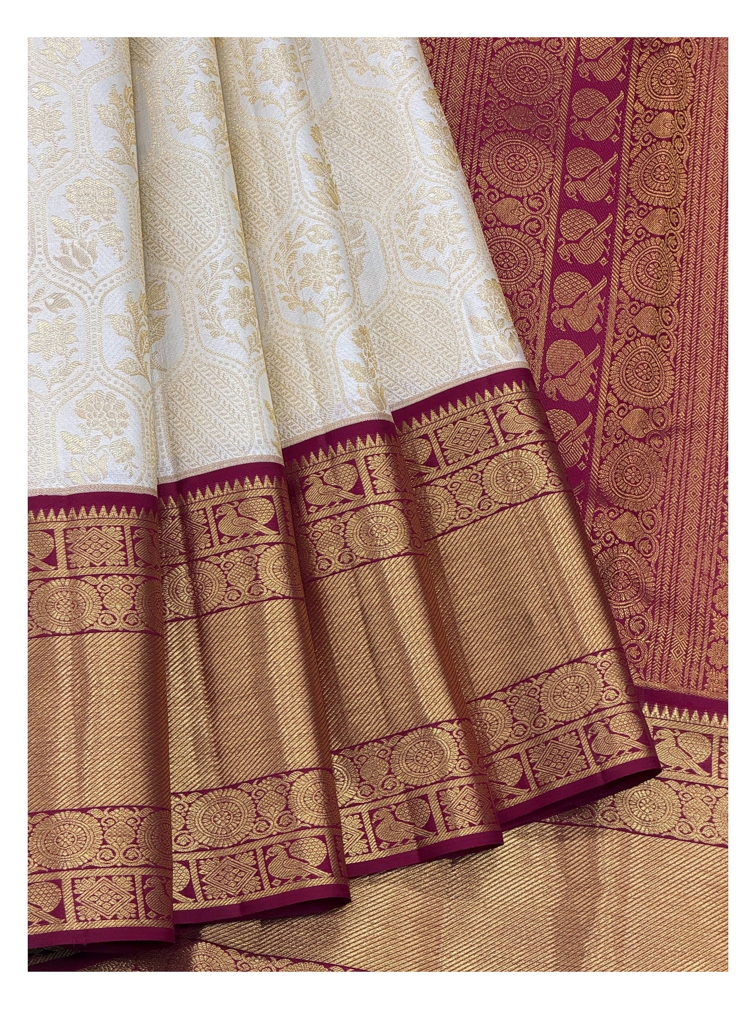 Soft Ivory Handwoven Kanchipuram Silk Saree with Floral Vine Weave and Magenta Elephant Zari Border front view