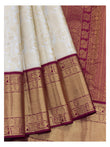 Soft Ivory Handwoven Kanchipuram Silk Saree with Floral Vine Weave and Magenta Elephant Zari Border front view