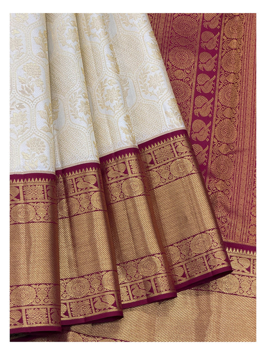 Soft Ivory Handwoven Kanchipuram Silk Saree with Floral Vine Weave and Magenta Elephant Zari Border front view