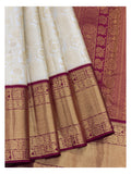 Soft Ivory Handwoven Kanchipuram Silk Saree with Floral Vine Weave and Magenta Elephant Zari Border front view