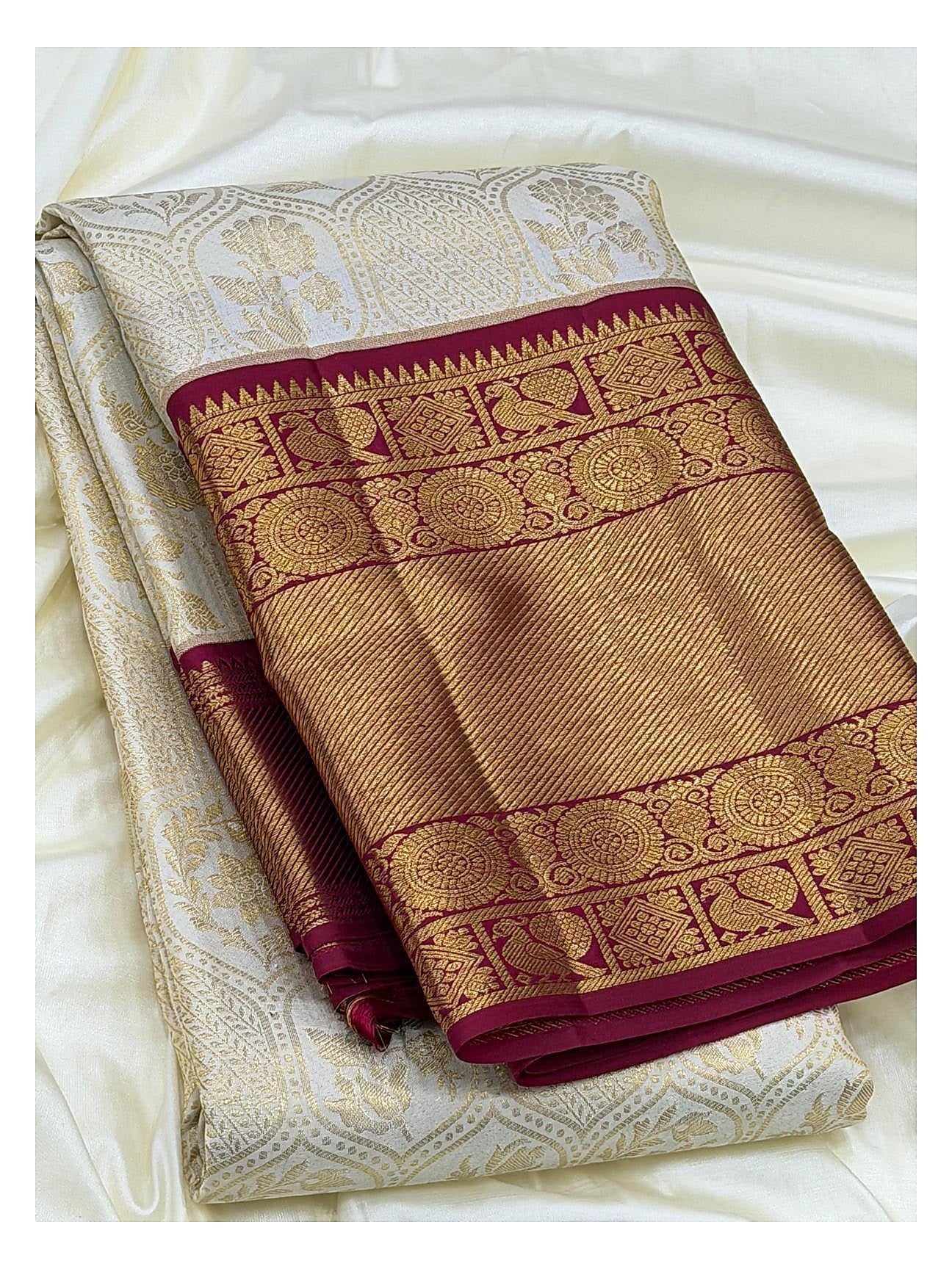 Soft Ivory Handwoven Kanchipuram Silk Saree with Floral Vine Weave and Magenta Elephant Zari Border