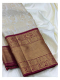 Soft Ivory Handwoven Kanchipuram Silk Saree with Floral Vine Weave and Magenta Elephant Zari Border