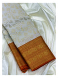 Soft Ivory Handwoven Kanchipuram Silk Saree with Gold Floral Vine Motifs and Broad Orange Gold Zari Border