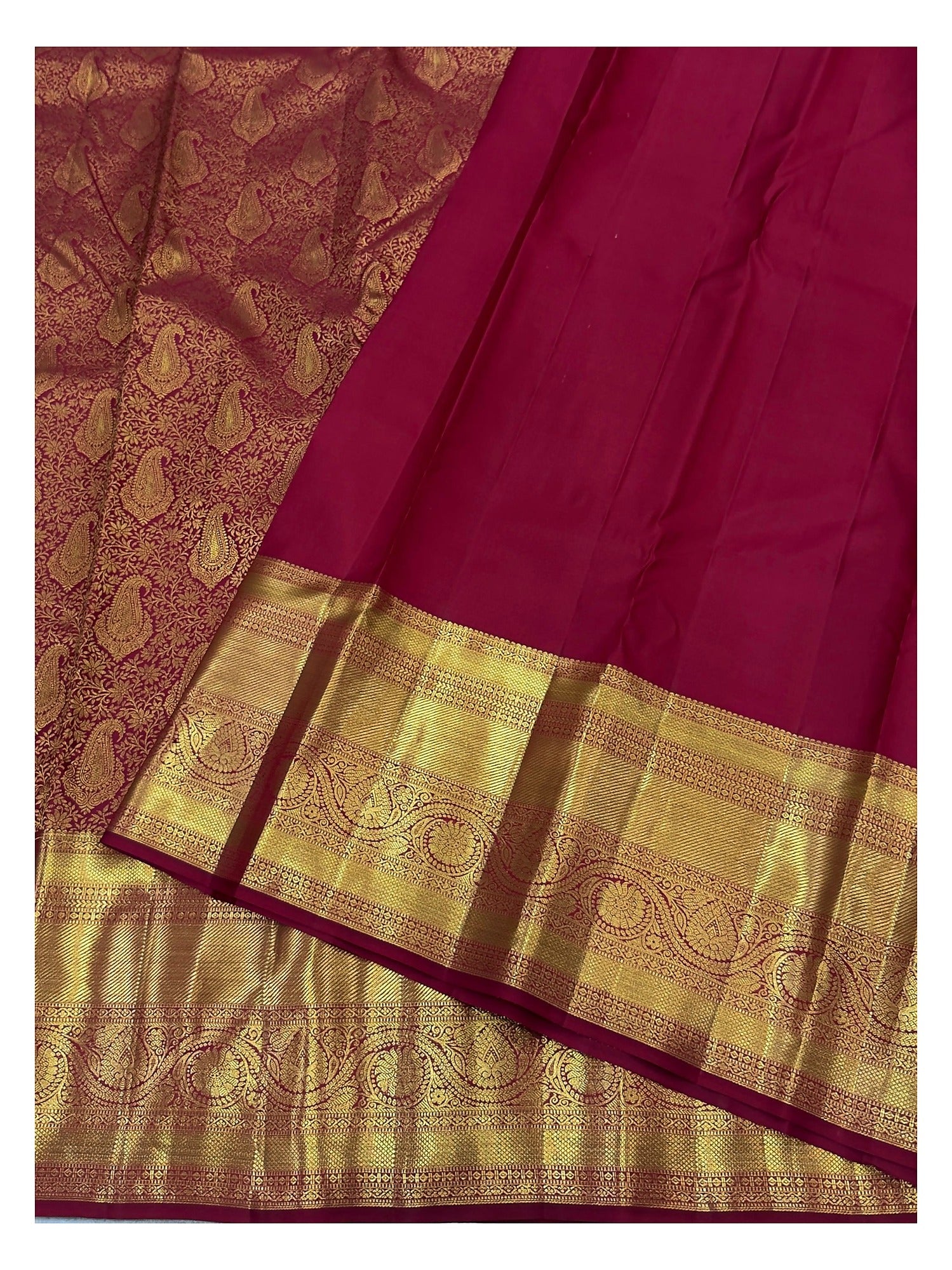 Wine Kanchipuram silk saree with broad rich gold woven border and matching blouse piece
