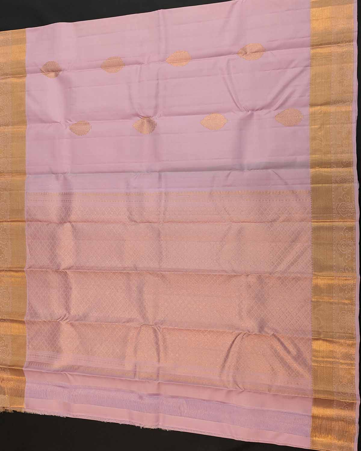 Beautiful light pink floral buttas adorn these traditional Kancheepuram silk sarees with self-designed borders