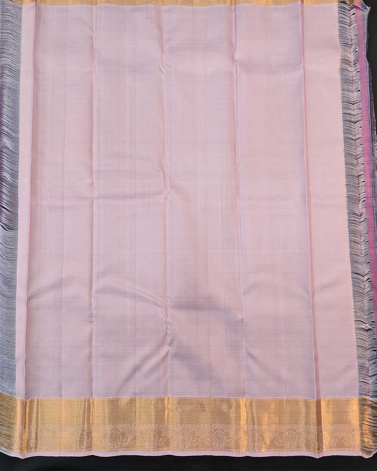 Beautiful light pink floral buttas adorn these traditional Kancheepuram silk sarees with self-designed borders