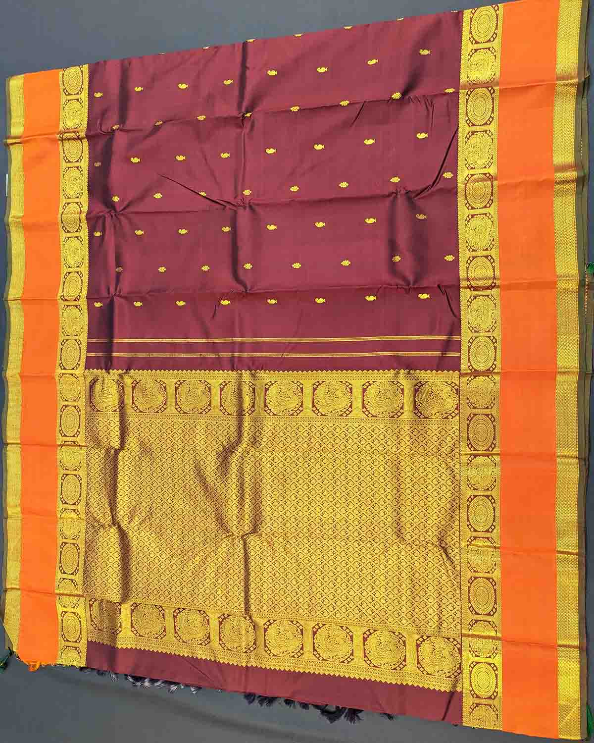 Dark red and orange silk saree with Annam Border, featuring gold