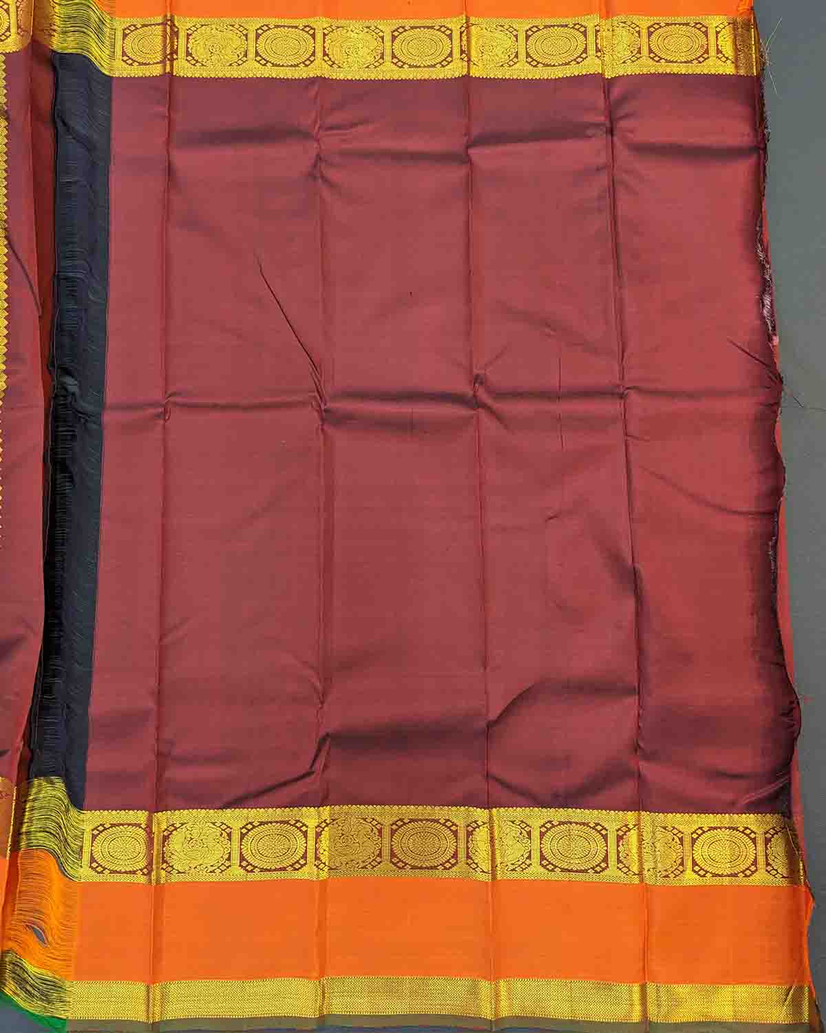 Dark red and orange silk saree with Annam Border, featuring gold