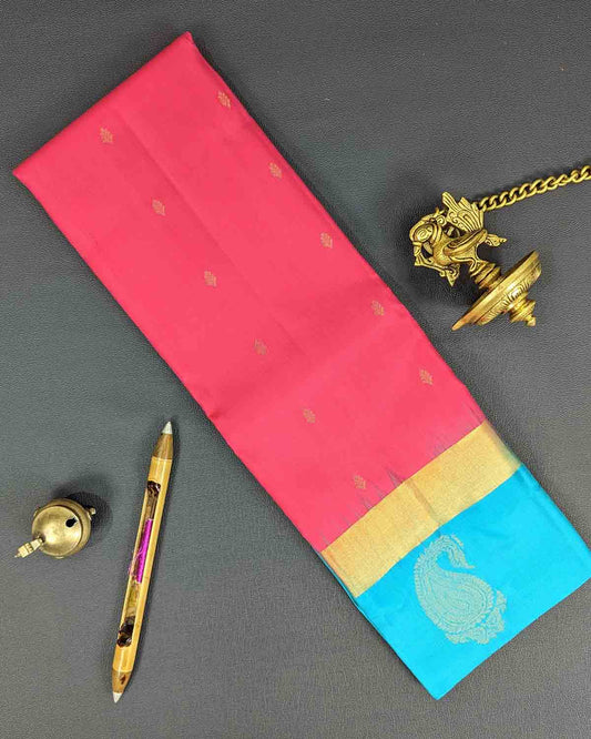 Pink Floral Buttas Kancheepuram Silk Saree with Blue Paisley Zari Border.