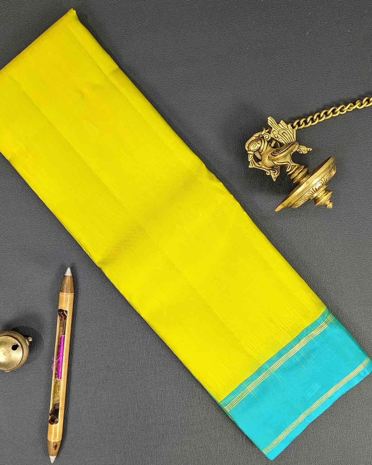 Yellow Kancheepuram Silk Sarees with leaf buttas, traditional and elegant