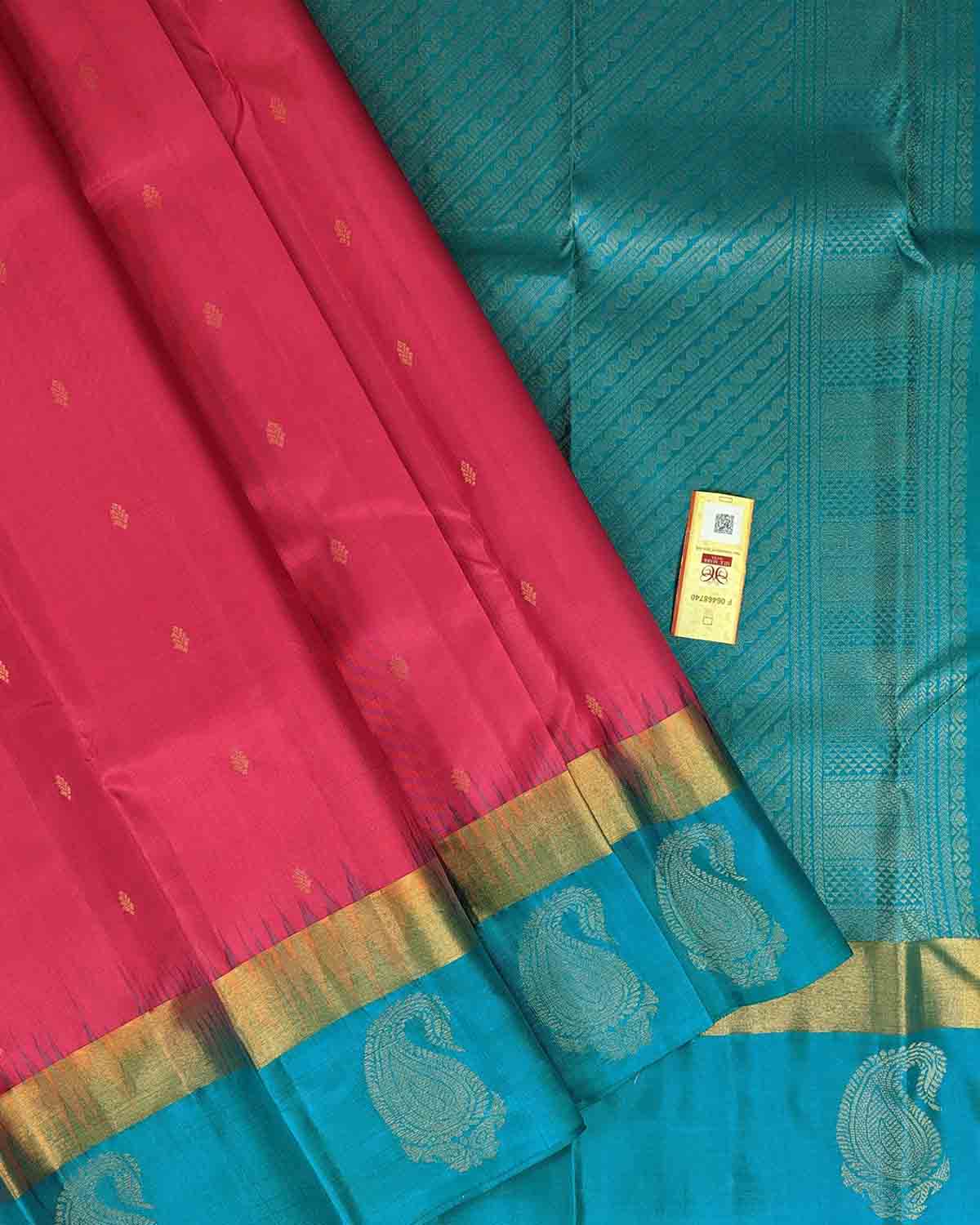 Pink Floral Buttas Kancheepuram Silk Saree with Blue Paisley Zari Border.