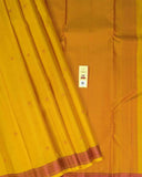 Sunset Yellow Kamalam Zari Buttas and Diamond Decorated Pallu