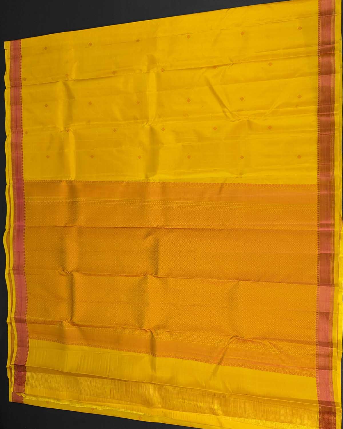 Sunset Yellow Kamalam Zari Buttas and Diamond Decorated Pallu