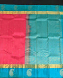 Pink Floral Buttas Kancheepuram Silk Saree with Blue Paisley Zari Border.