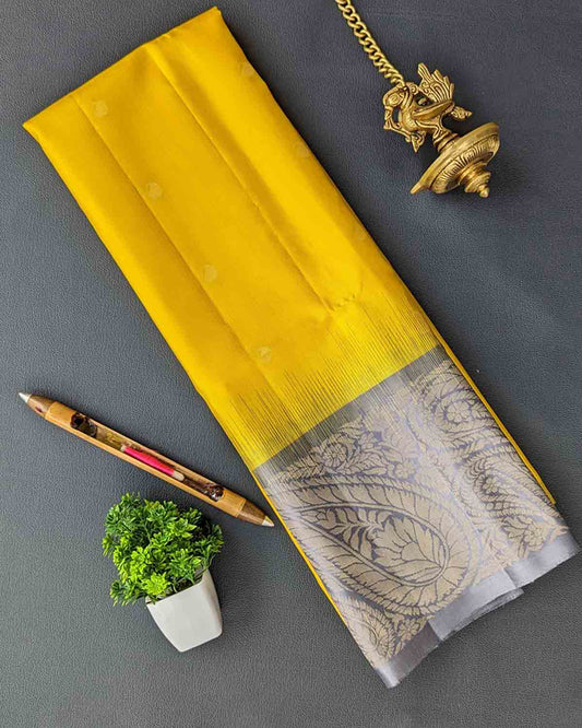 Yellow Kanchipuram soft silk saree with mango motifs, Annapakshi buttas, and paisley zari border